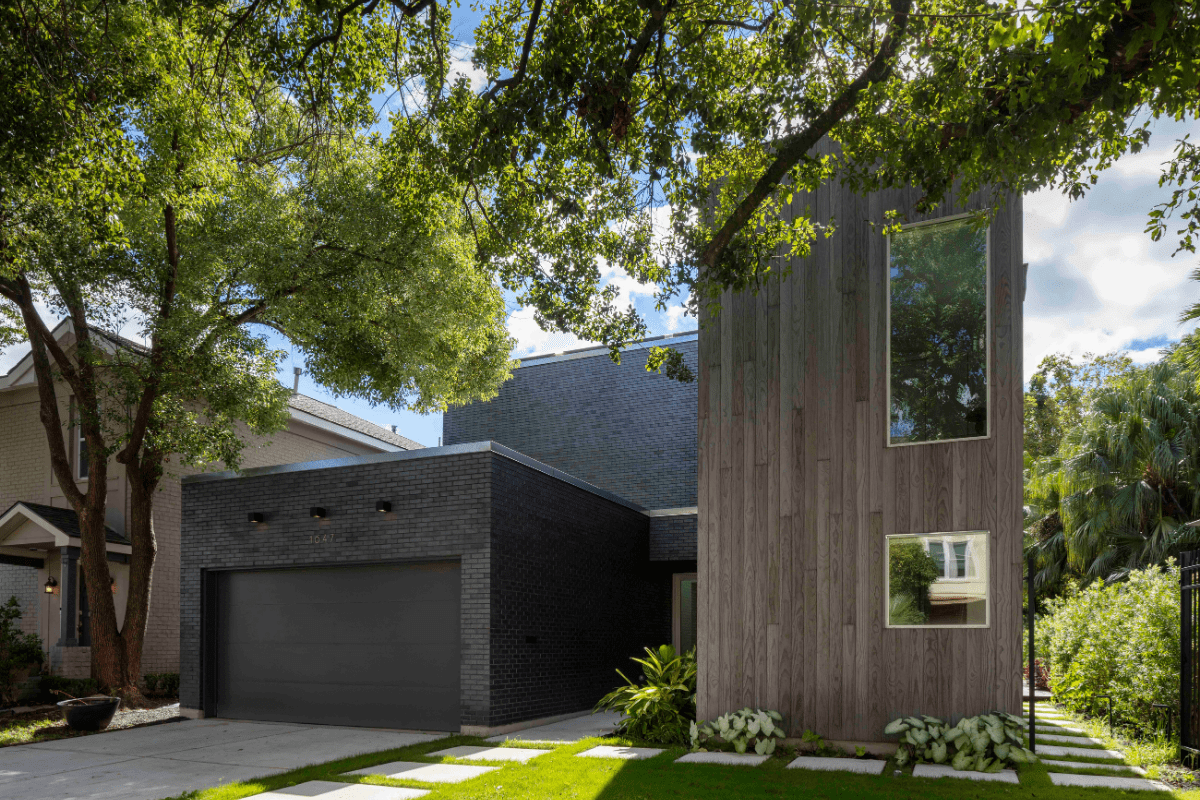 Exterior of Modern Rectangular Home Shrouded by Lush Green Trees in Yard
